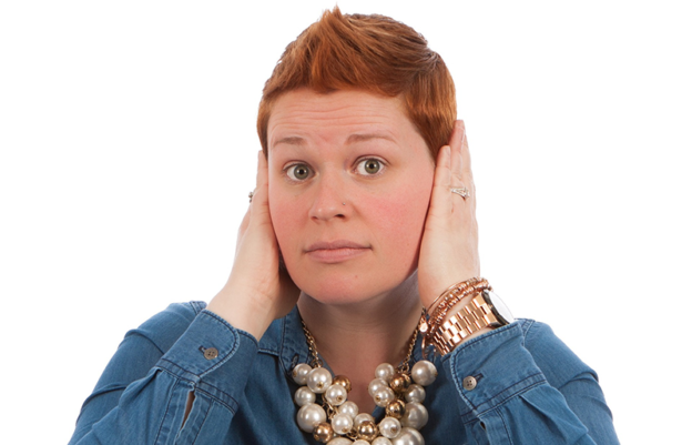 Woman hands over ears
